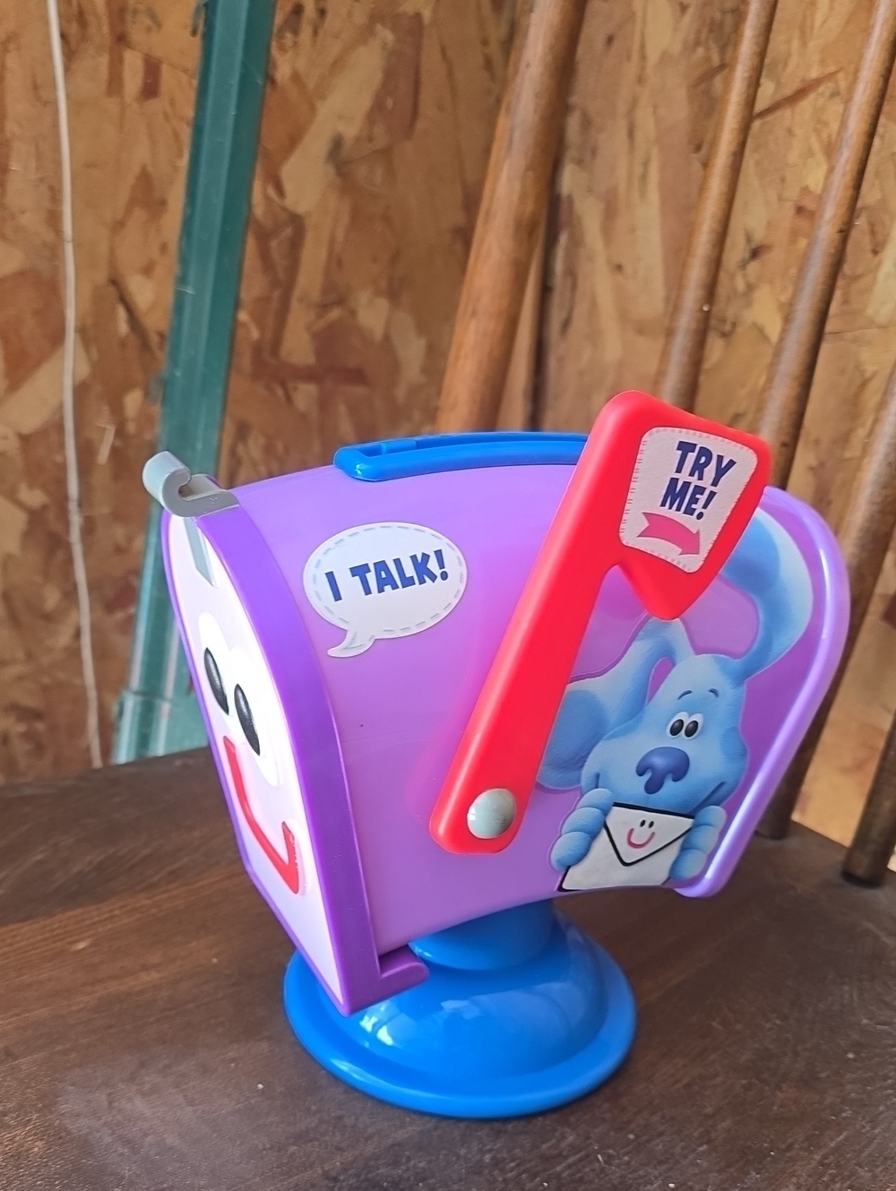 Interactive Purple Mailbox Toy with Blue Base and Red Flag
